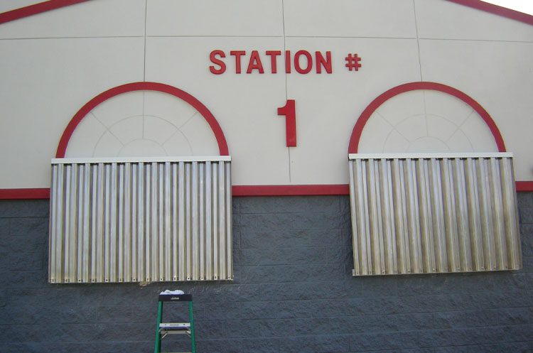 Steel Storm Panels on Firestation | Sentinel Storm Protection - Roll Down Shutters & Roll Screens in Naples and Fort Myers, Florida